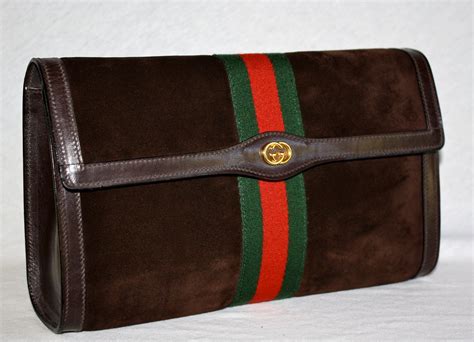 vintage gucci brown clutch|clutch gucci originally.